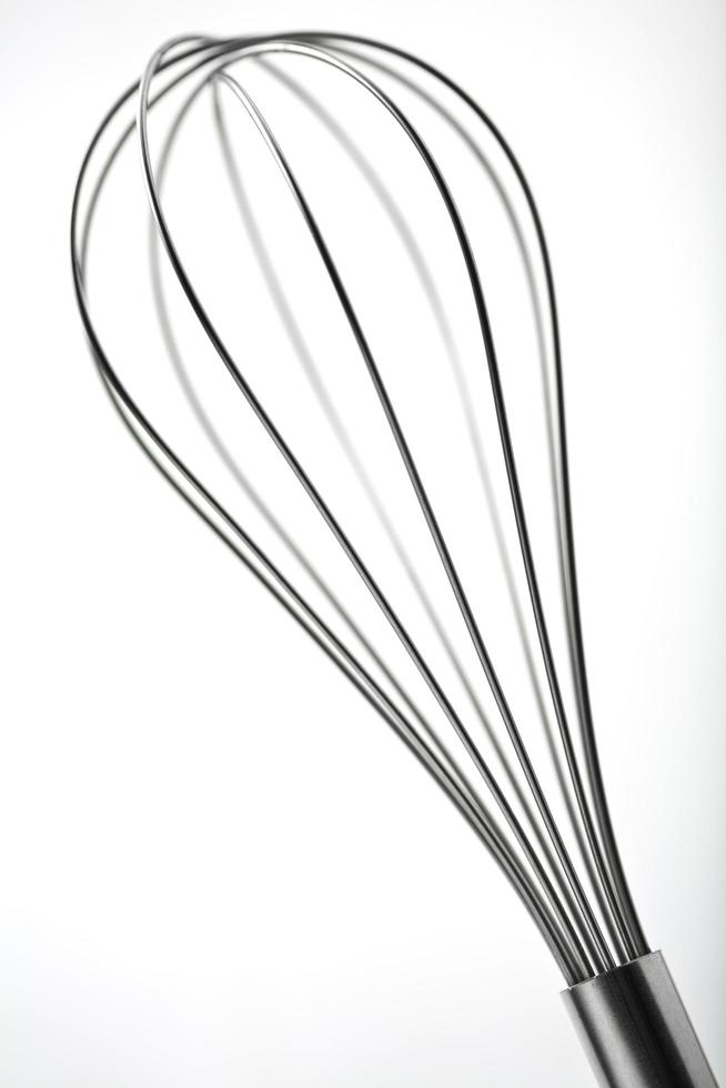 Stainless steel Egg Whisk or Egg Beater on white photo