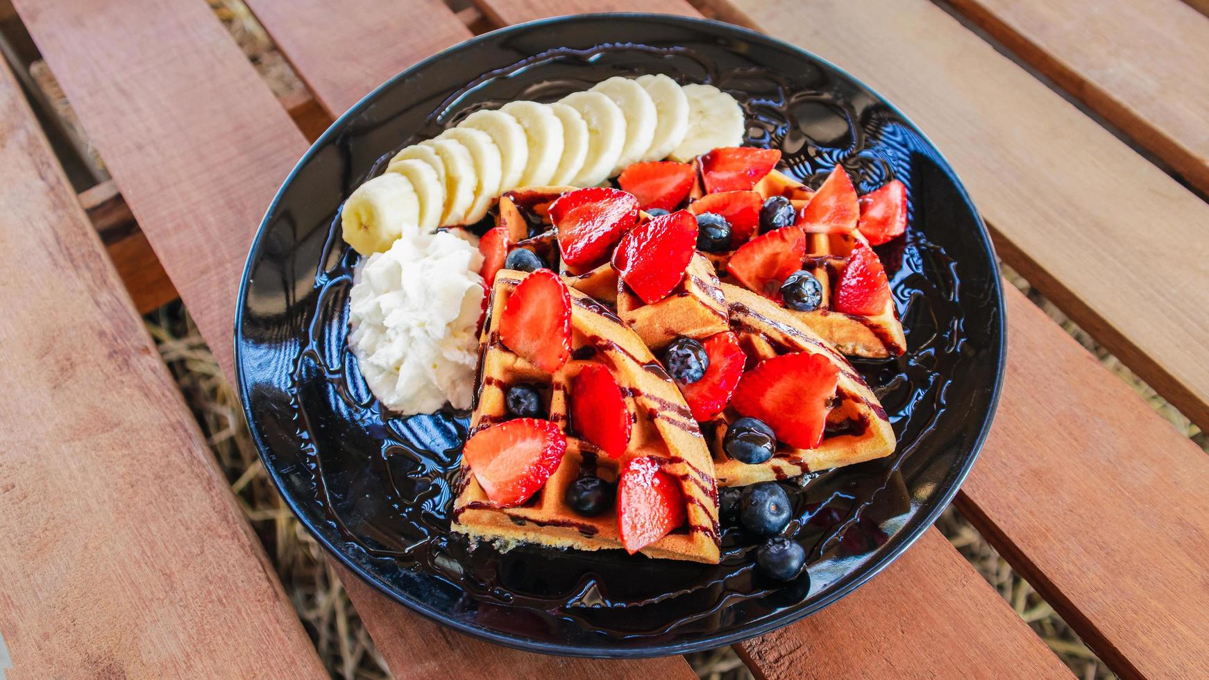 Banana split strawberry and blueberry cake waffles photo