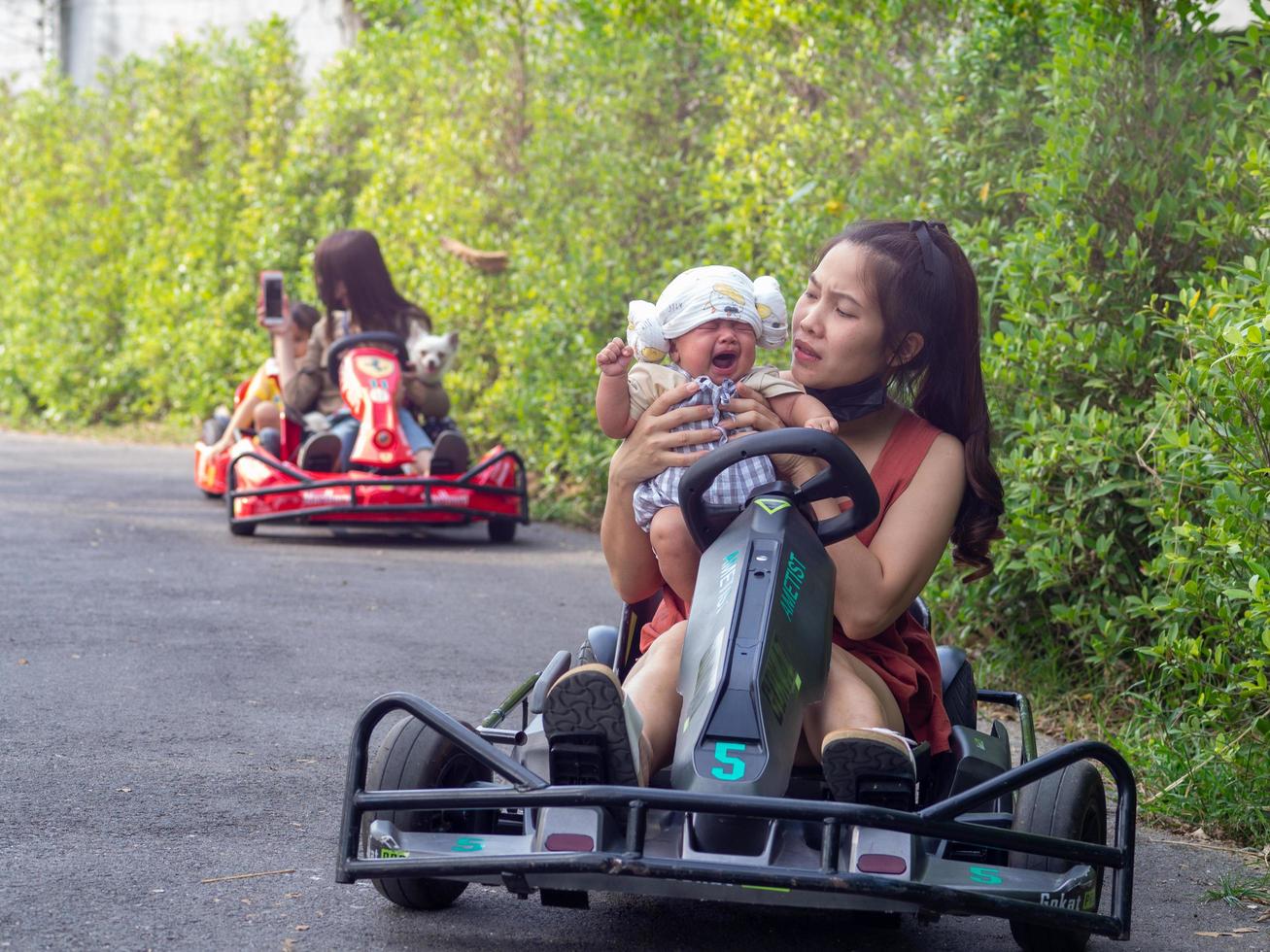 woman and baby on go cart photo