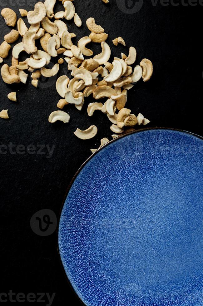 Cashew nuts in blue plate photo