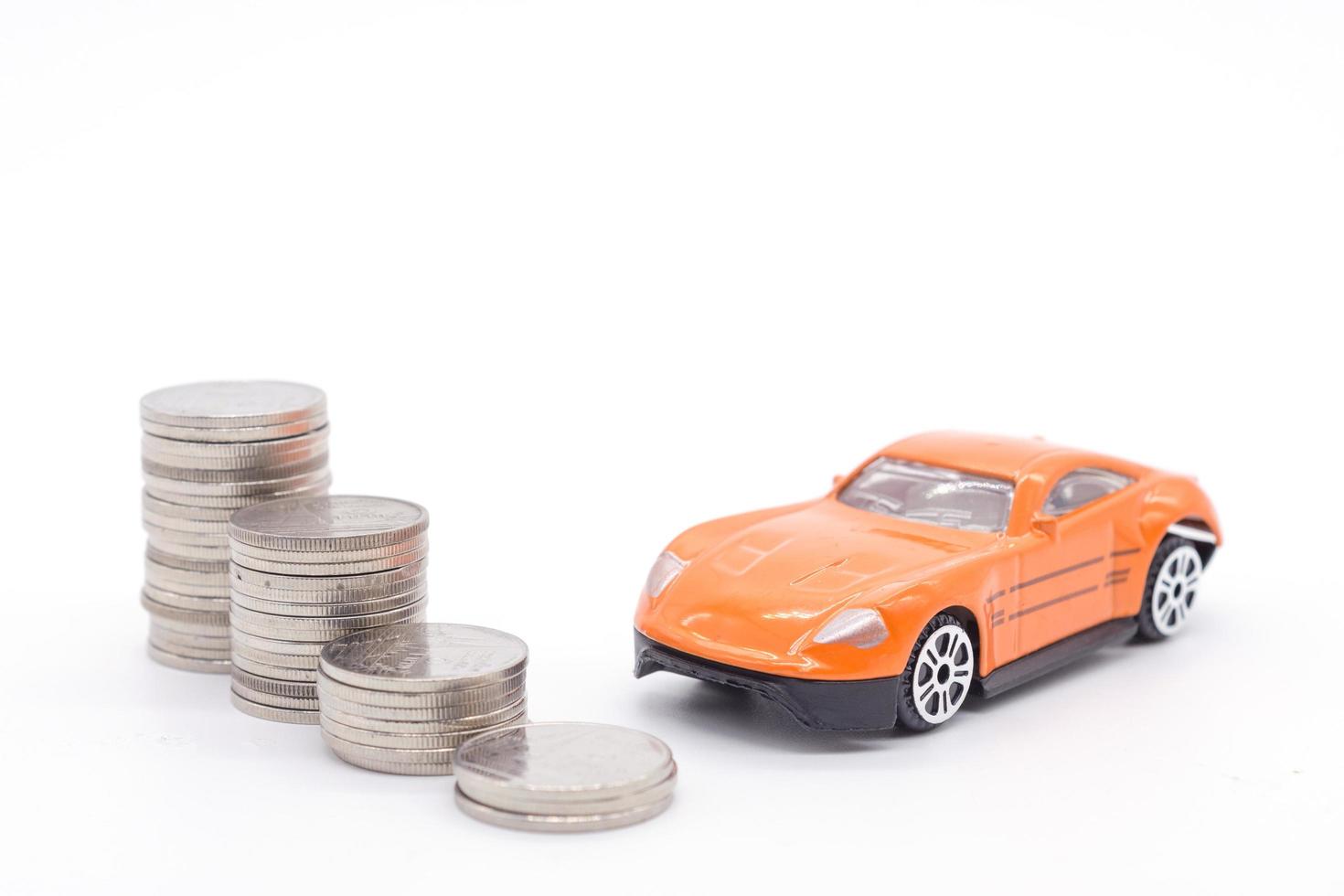 Car and stack coins on white background photo