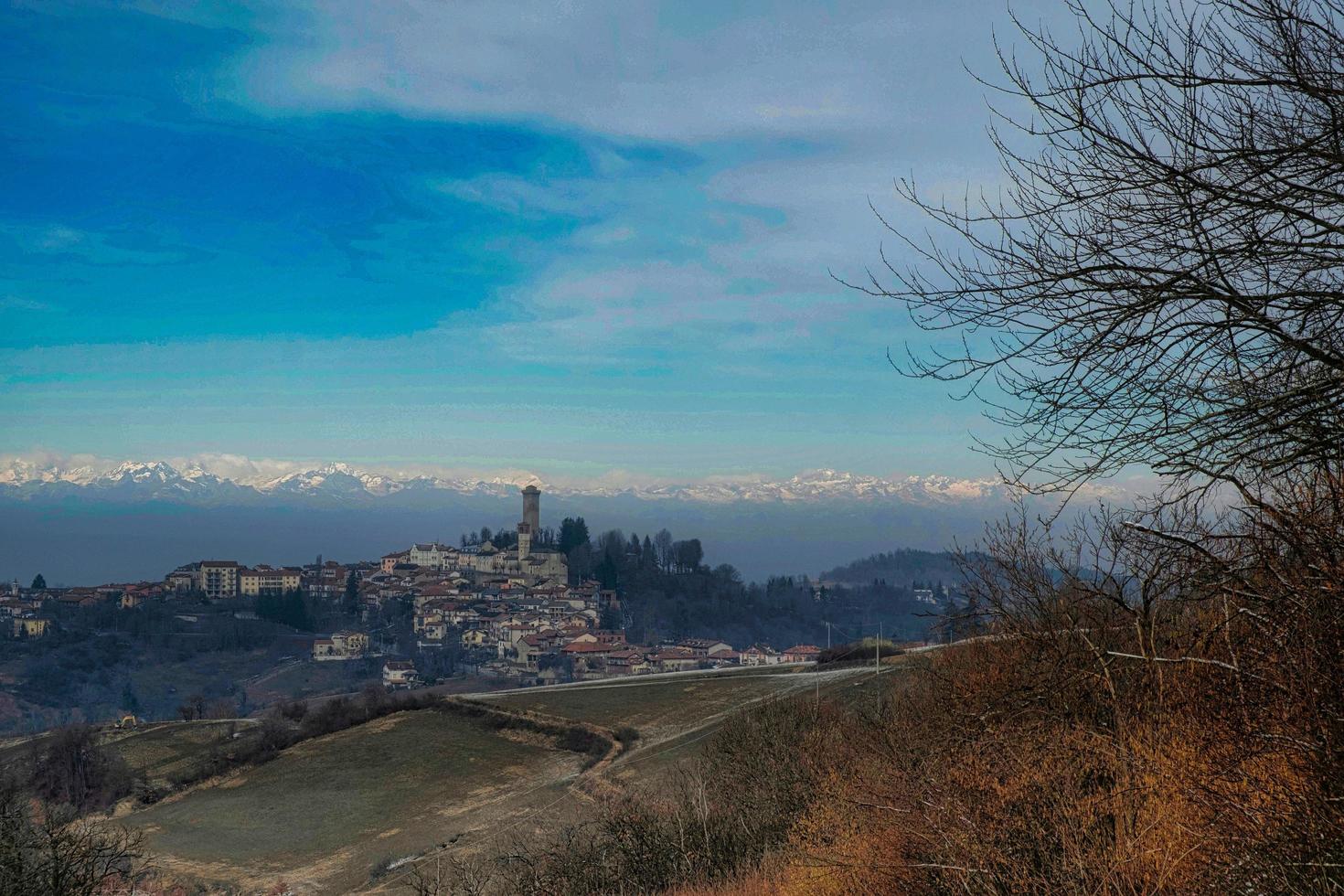 the tower and the village of murazzano in the Piedmontese Langhe, immersed in the winter snow of 2022 photo