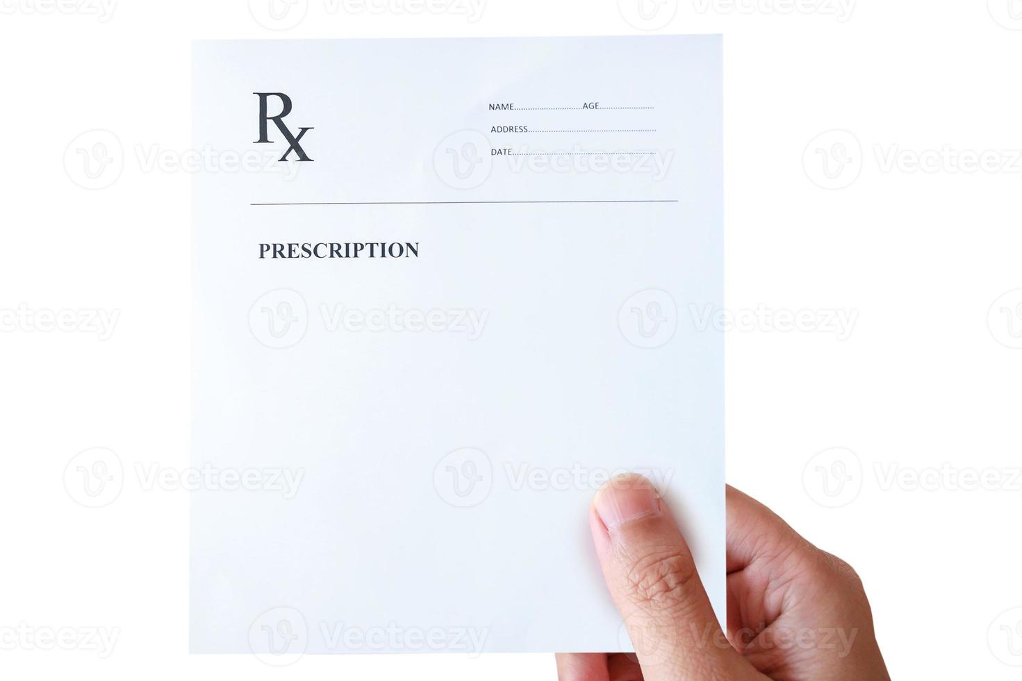 hand holding prescription rx paper photo