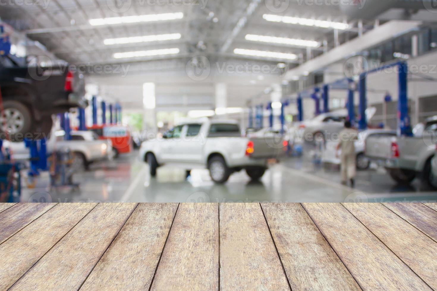 Wood table top with blur garage background photo