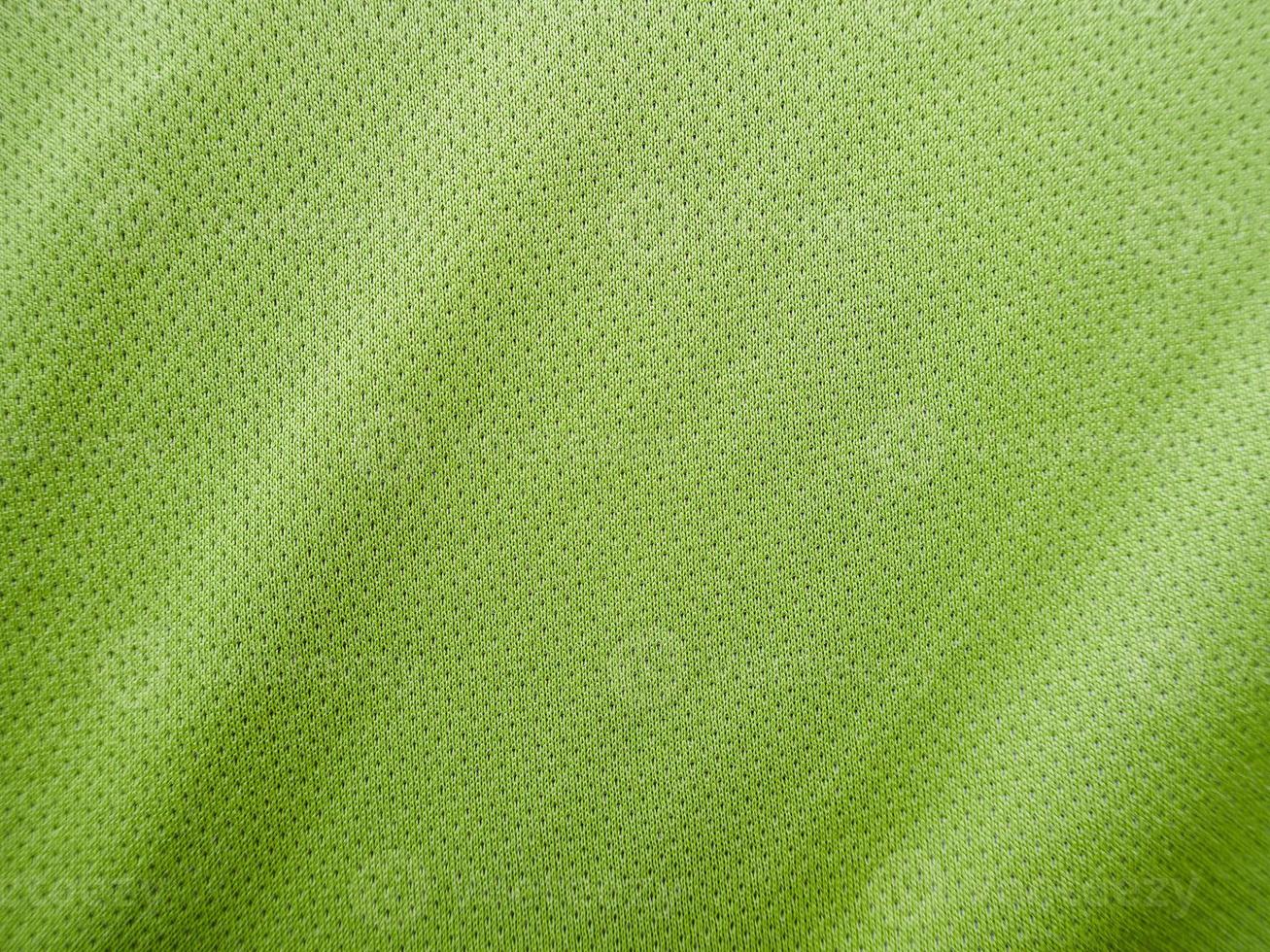 textura de jersey de tela de ropa deportiva verde foto