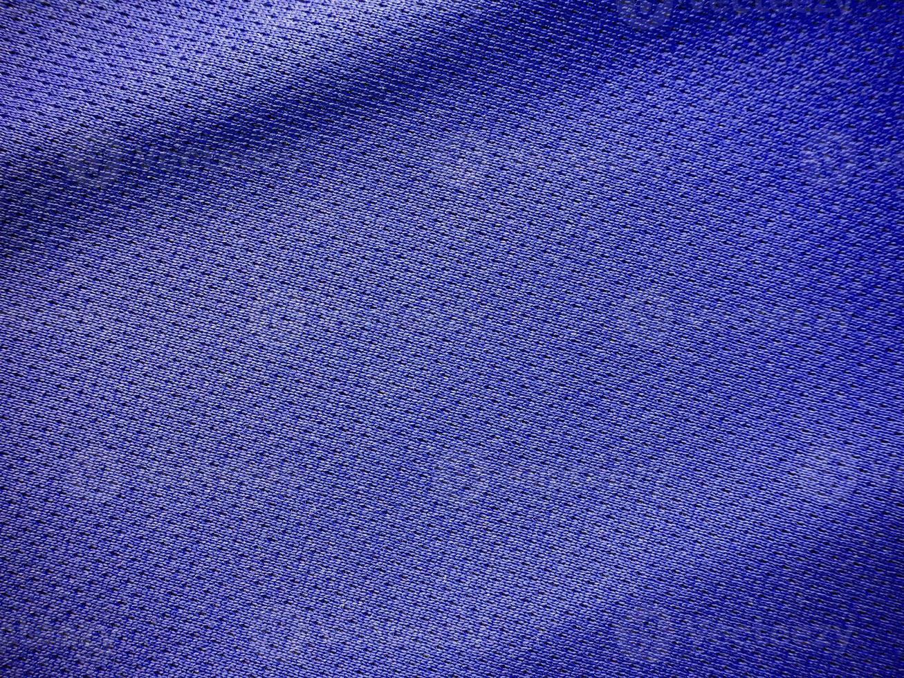 textura de jersey de tela de ropa deportiva azul foto