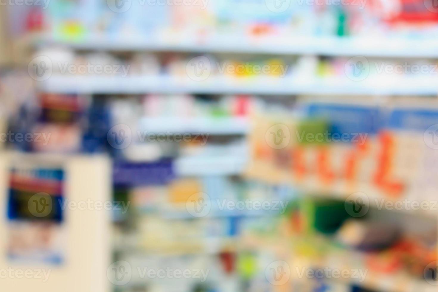 Medicines arranged in shelves at pharmacy photo