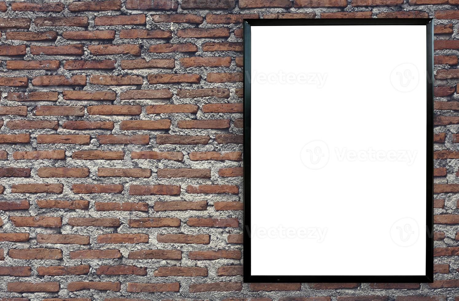 blank poster photo frame on vintage brick wall