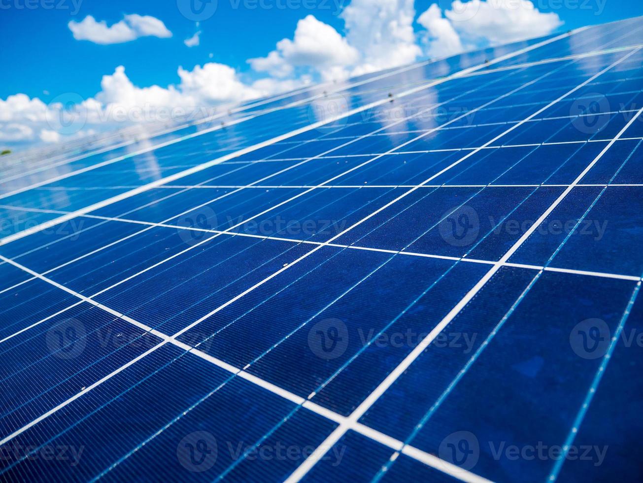 Solar panels with blue sky and clouds photo