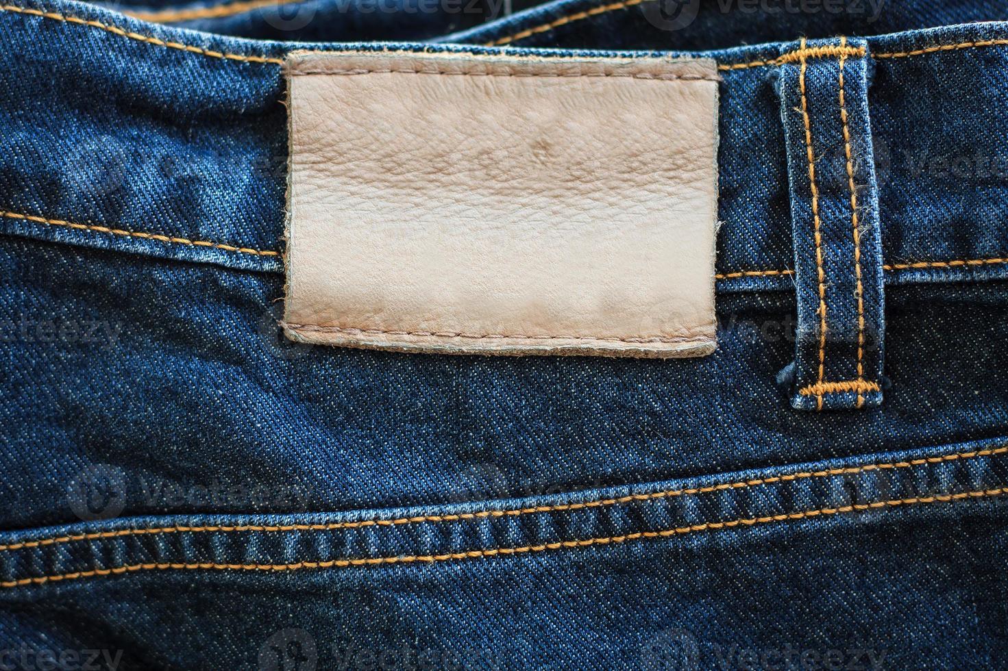 Jeans texture with leather label photo