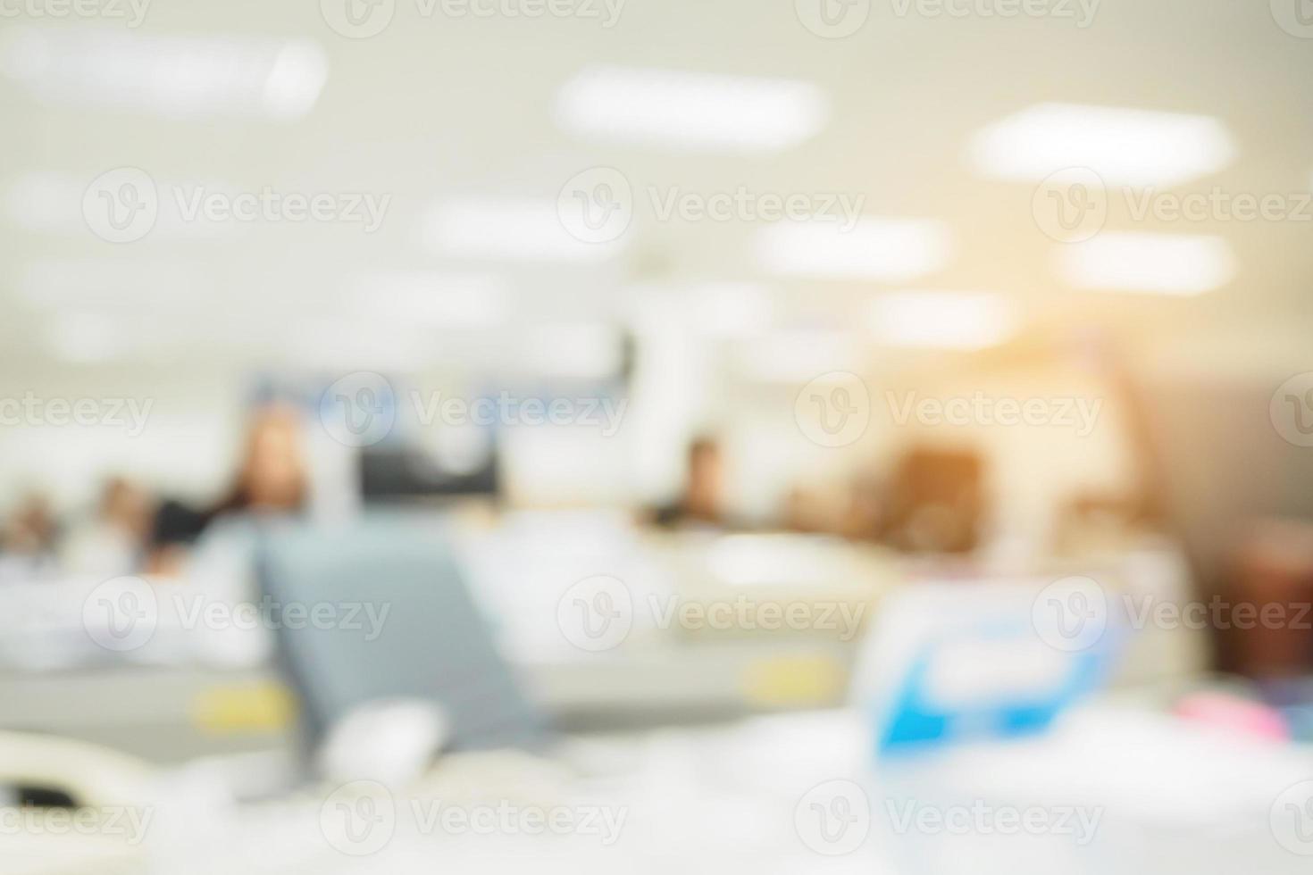 office blurred background with people working at desk photo
