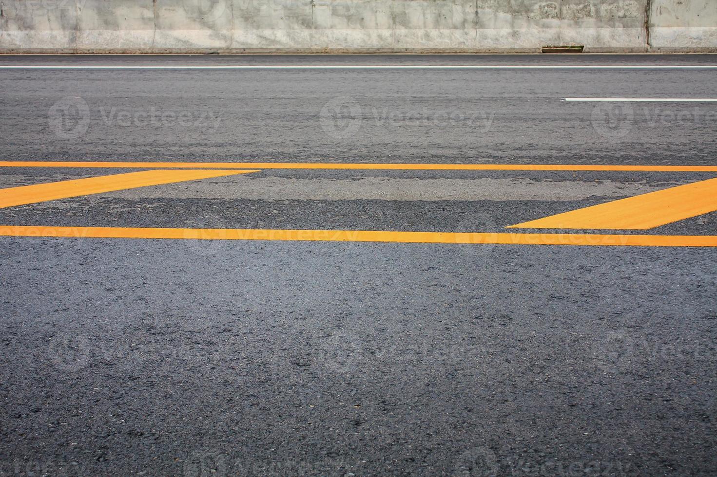 Asphalt road texture background with yellow dashed line photo