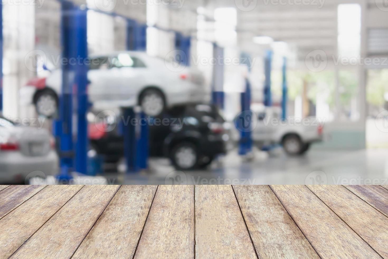 Wood table top with blur garage background photo