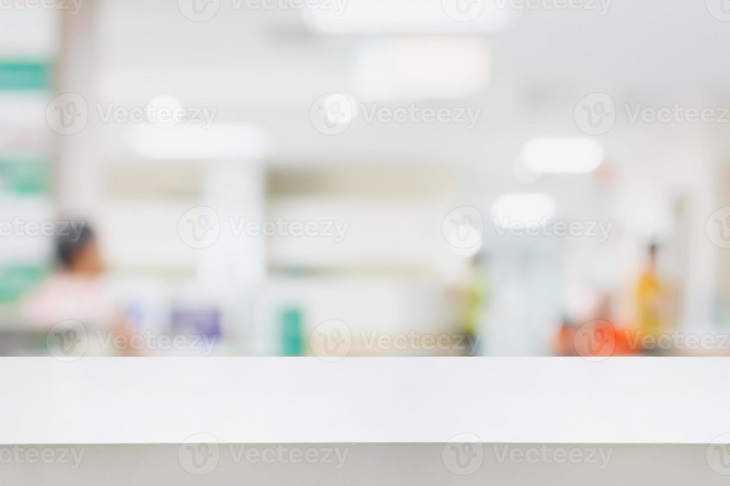 Empty white desk with blur hospital background photo