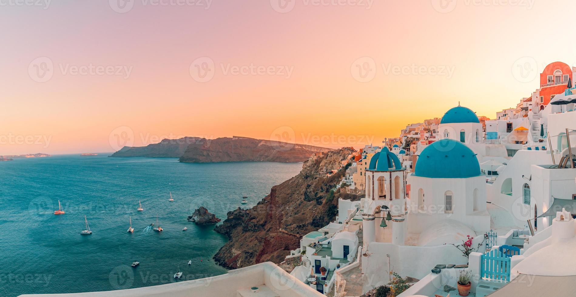 Amazing evening view of Santorini island. Picturesque spring sunset on the famous Oia, Greece, Europe. Traveling concept background. Summer vacation destination photo