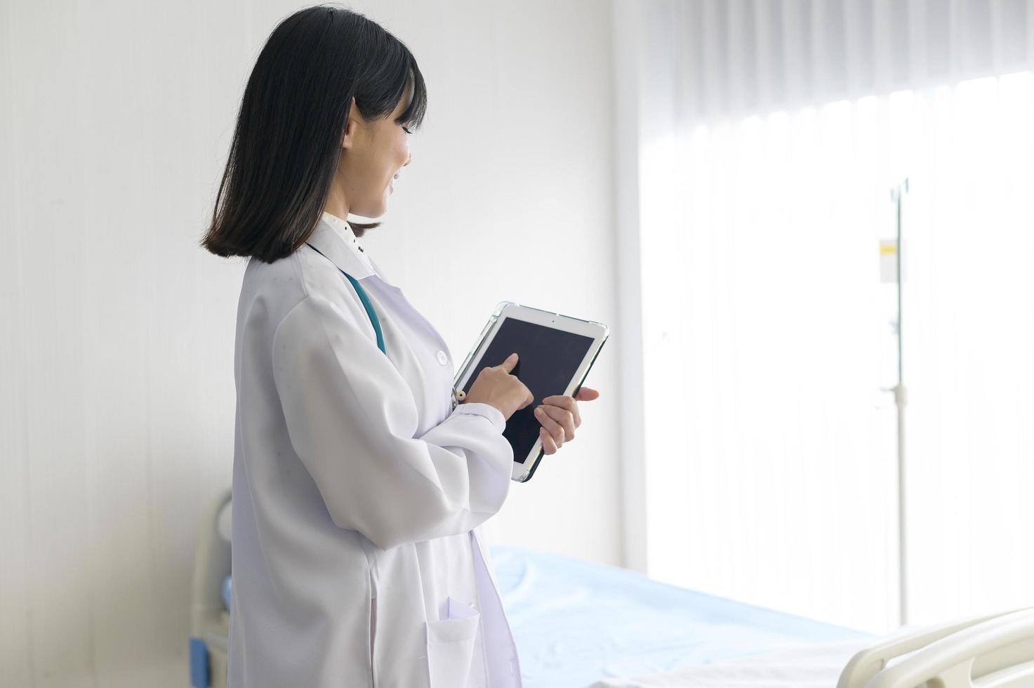 Portrait of young female doctor with stethoscope working at hospital, medical and health care concept photo