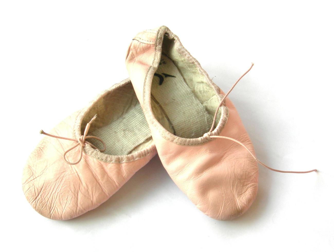 Young ballerina dancing shoes photo