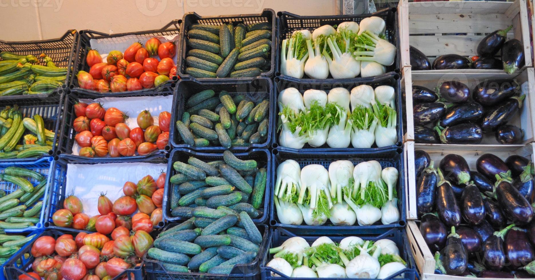 Vegetables in crate on a market shelf photo