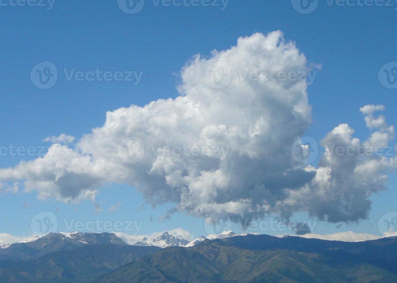 Clouds over mountain photo