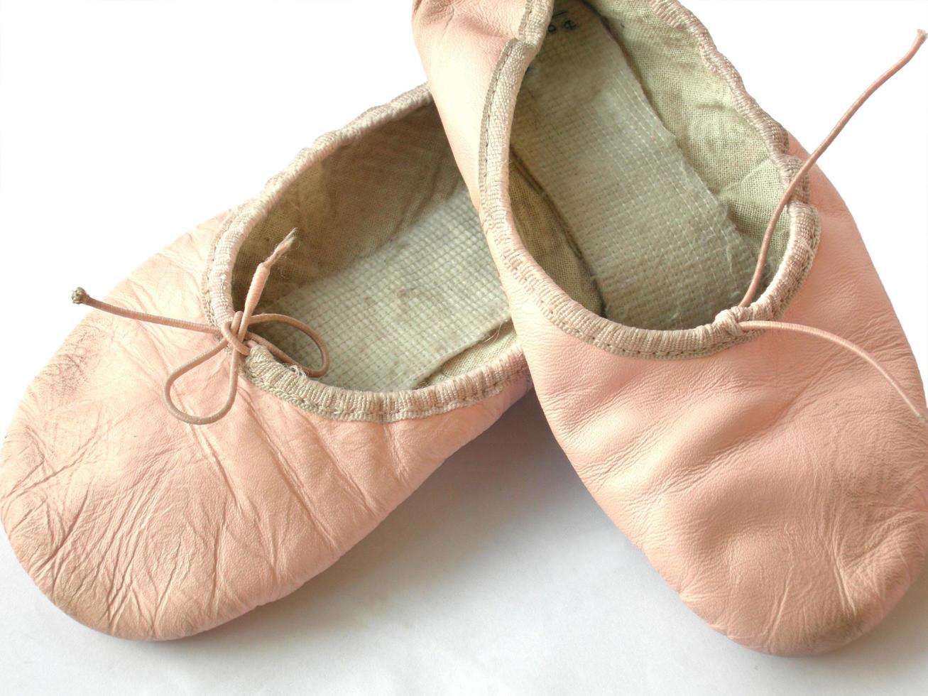 Young ballerina dancing shoes photo