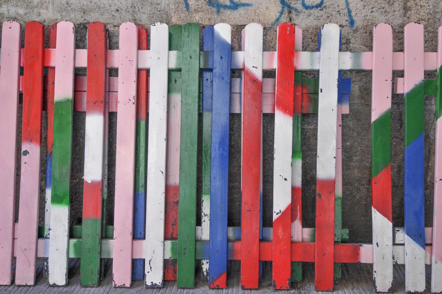 A brightly coloured wooden fence photo