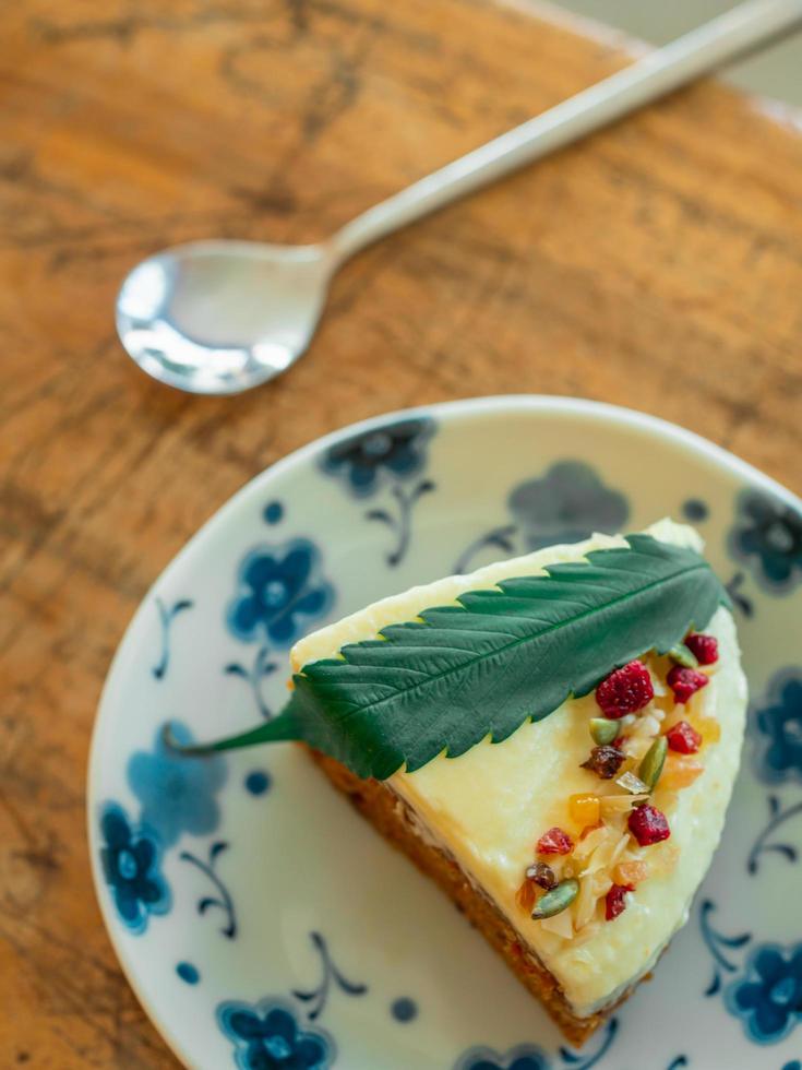 Carrot Cake with fresh cannabis leaf. photo