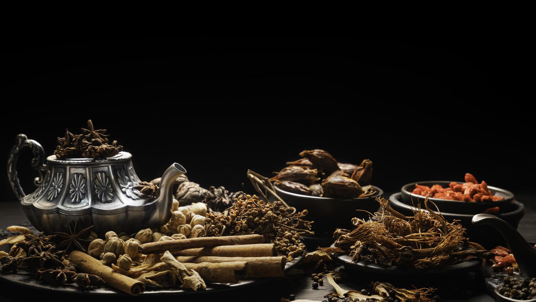 Condiments or spices for red curry or Thai food. Ingredients Food Spices Pepper, coriander seeds, dried chilies, turmeric, garlic. photo