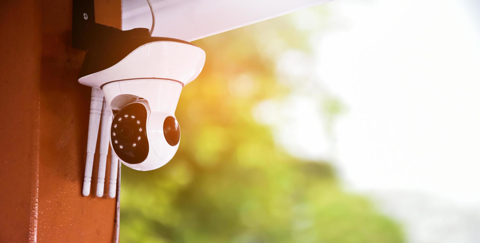 Mini cctv cameras installed on the wall outside the house to record and to do security at home when the house owner stayed outside, soft and selective focus on cctv cameras. photo