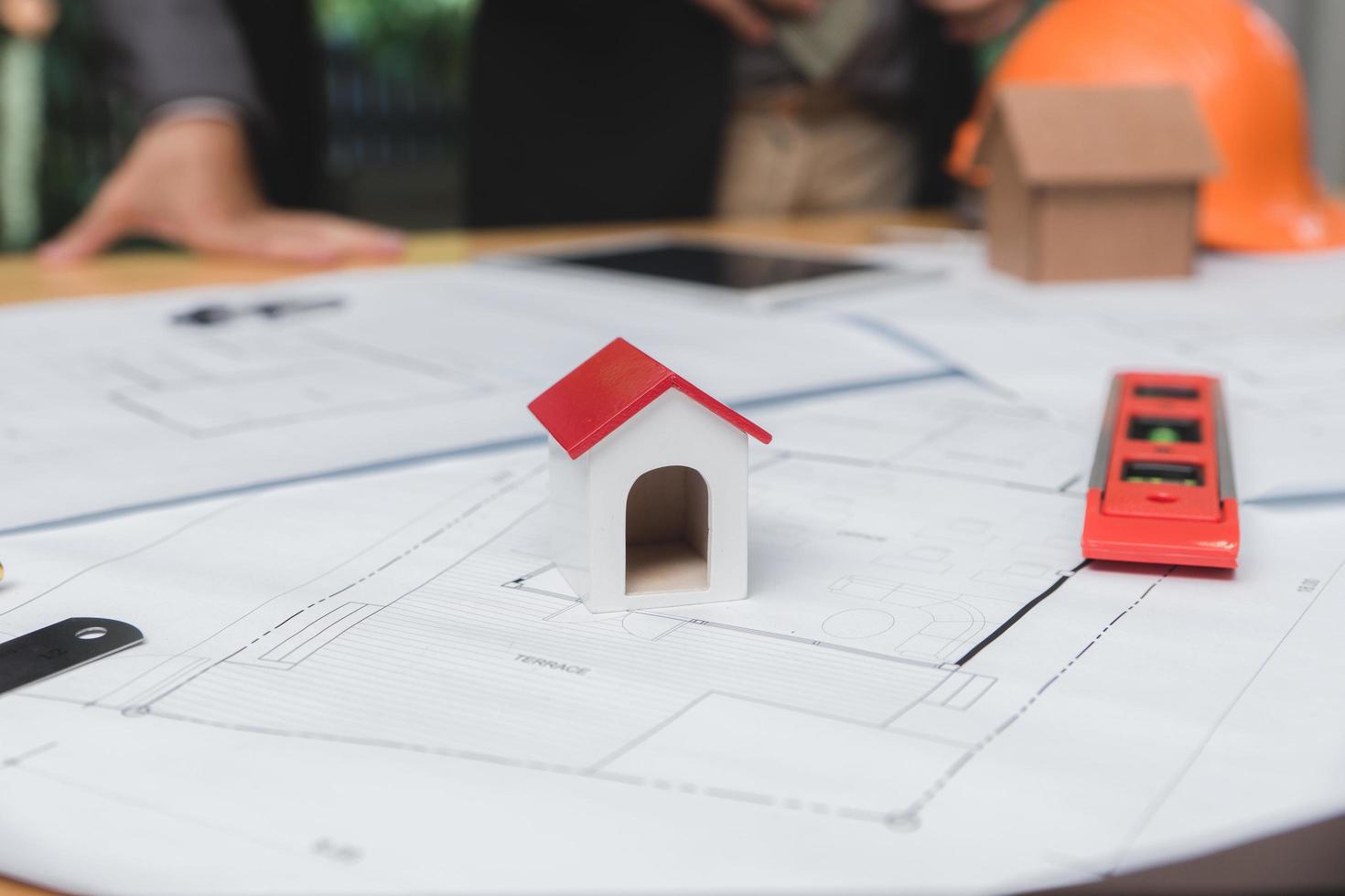 Architects engineer discussing on desk with blueprint. Team group on construciton site check documents and business workflow.Construction concept. Engineering tools.Vintage effect.Selective focus. photo
