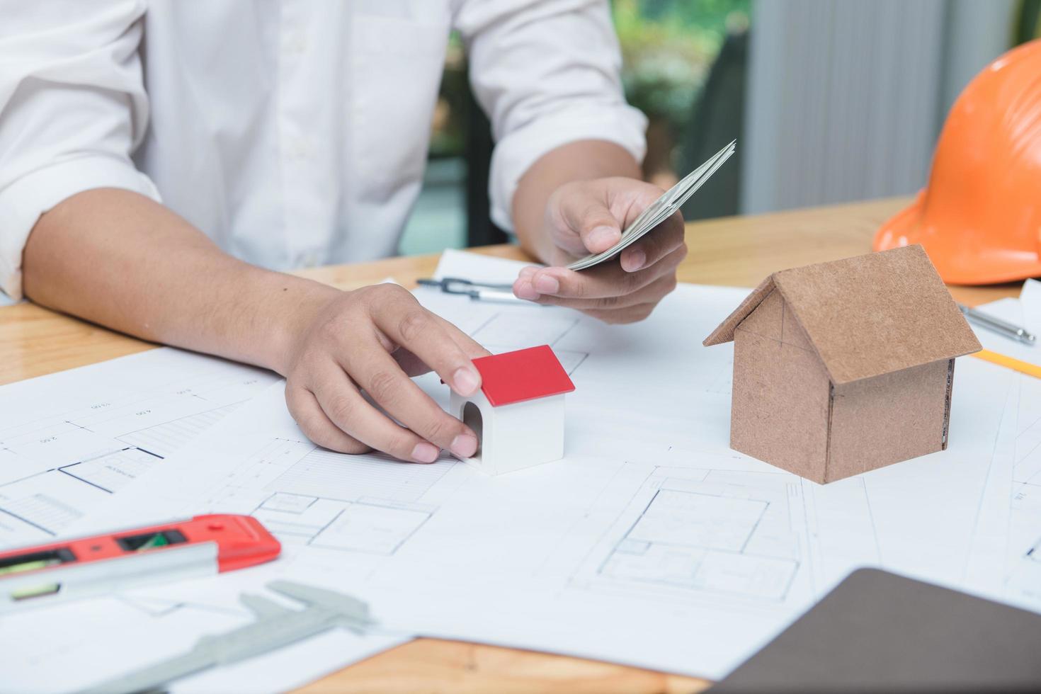 Architects engineer discussing on desk with blueprint. Team group on construciton site check documents and business workflow.Construction concept. Engineering tools.Vintage effect.Selective focus. photo