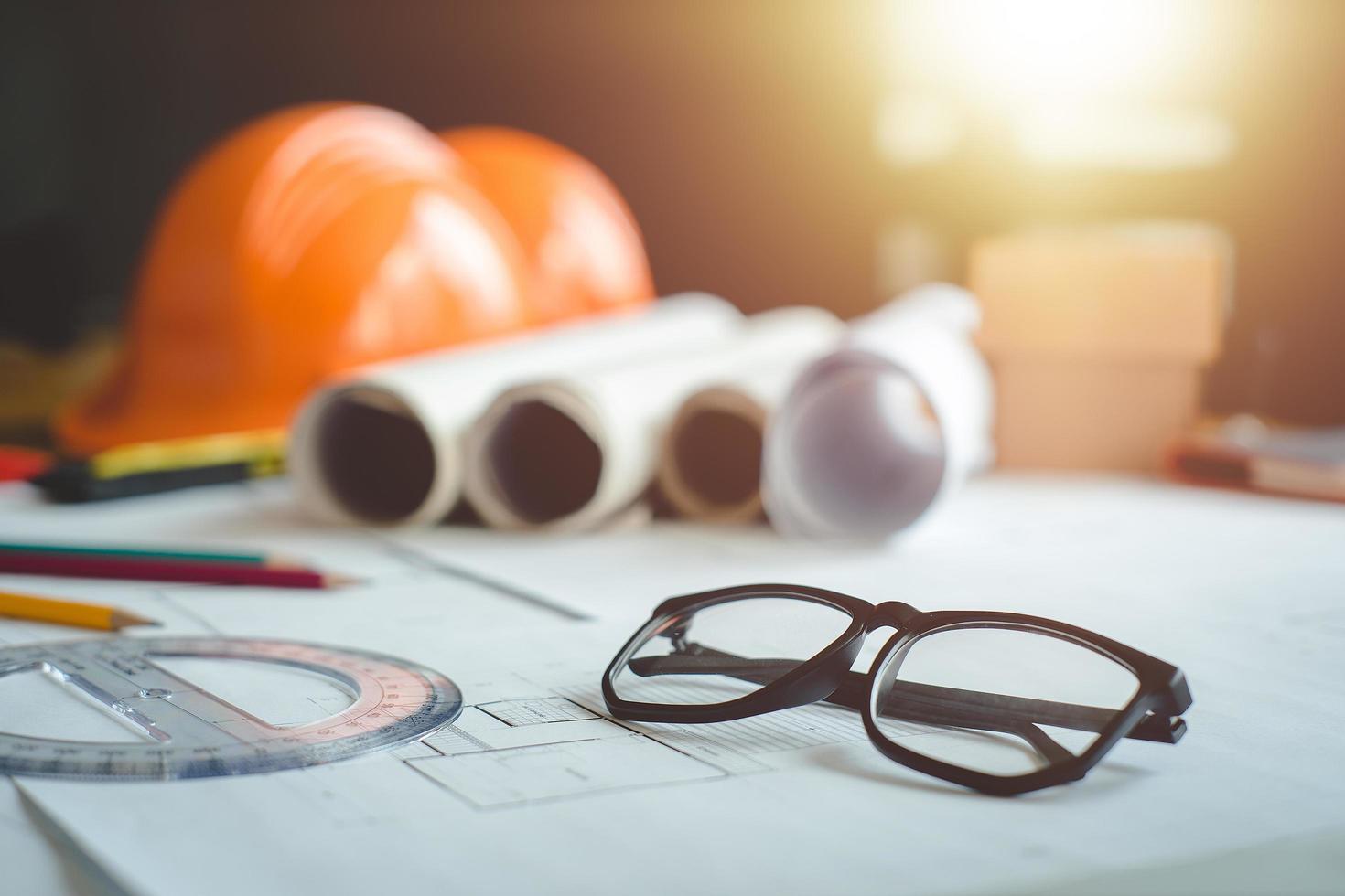 Architectural plans work apace. Architectural project,blueprints,pencil ,labtop and divider compass on wooden desk table.Construction background.Engineering tools. Copy space.Architectural Concept photo