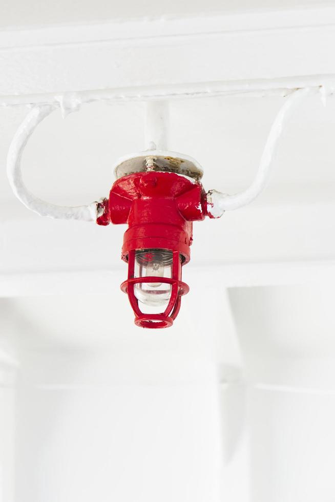 Close-up of red light bulbs on the ship's ceiling. photo