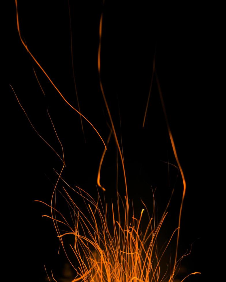 fire flames with sparks on a black background photo