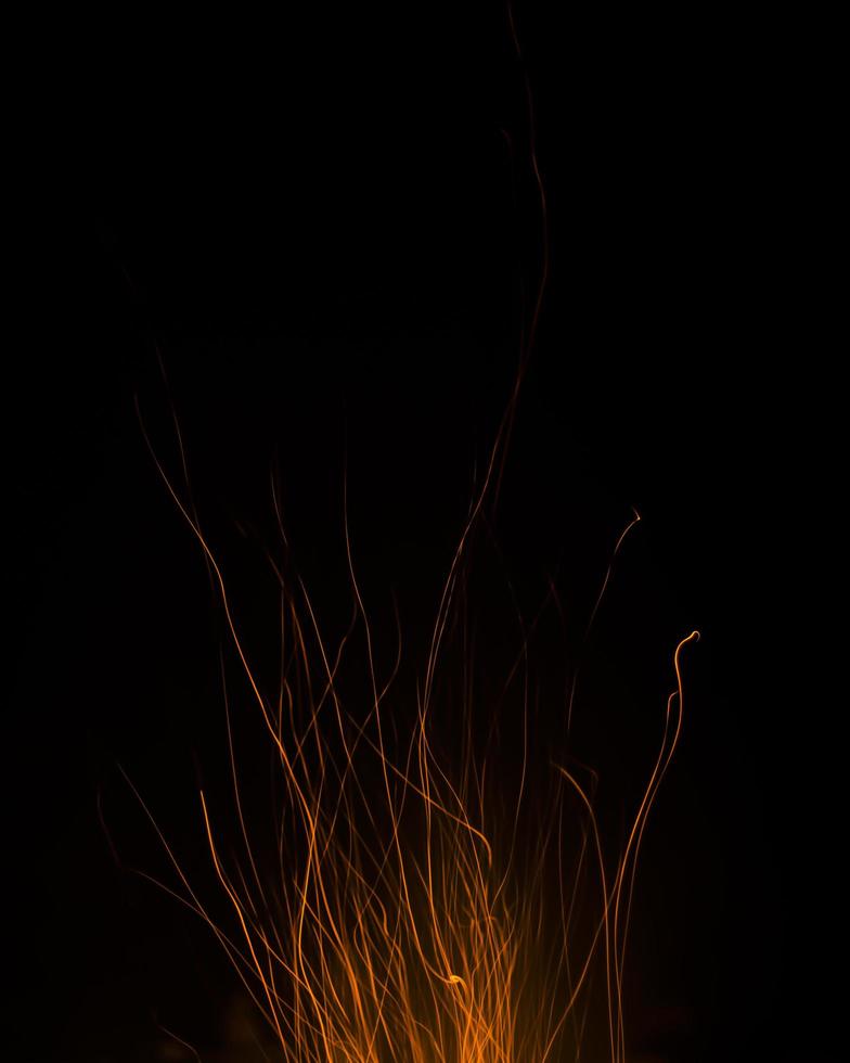 fire flames with sparks on a black background photo