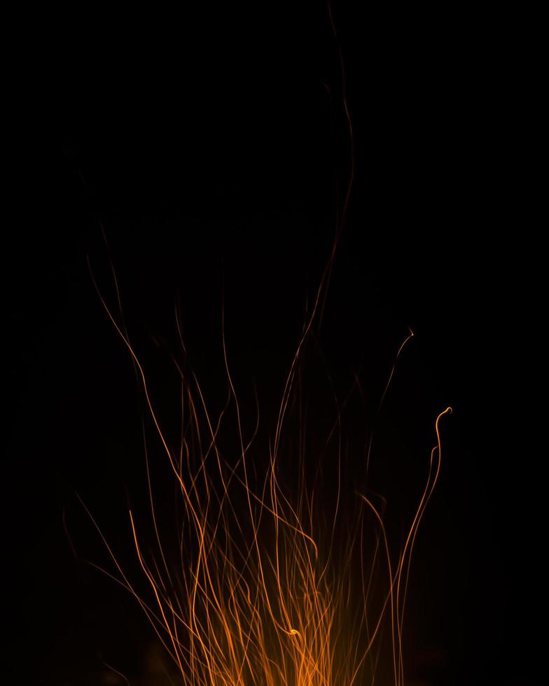 fire flames with sparks on a black background photo