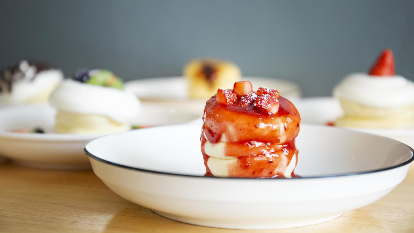 Japanese-style pancakes on a wooden table are ready to serve. photo