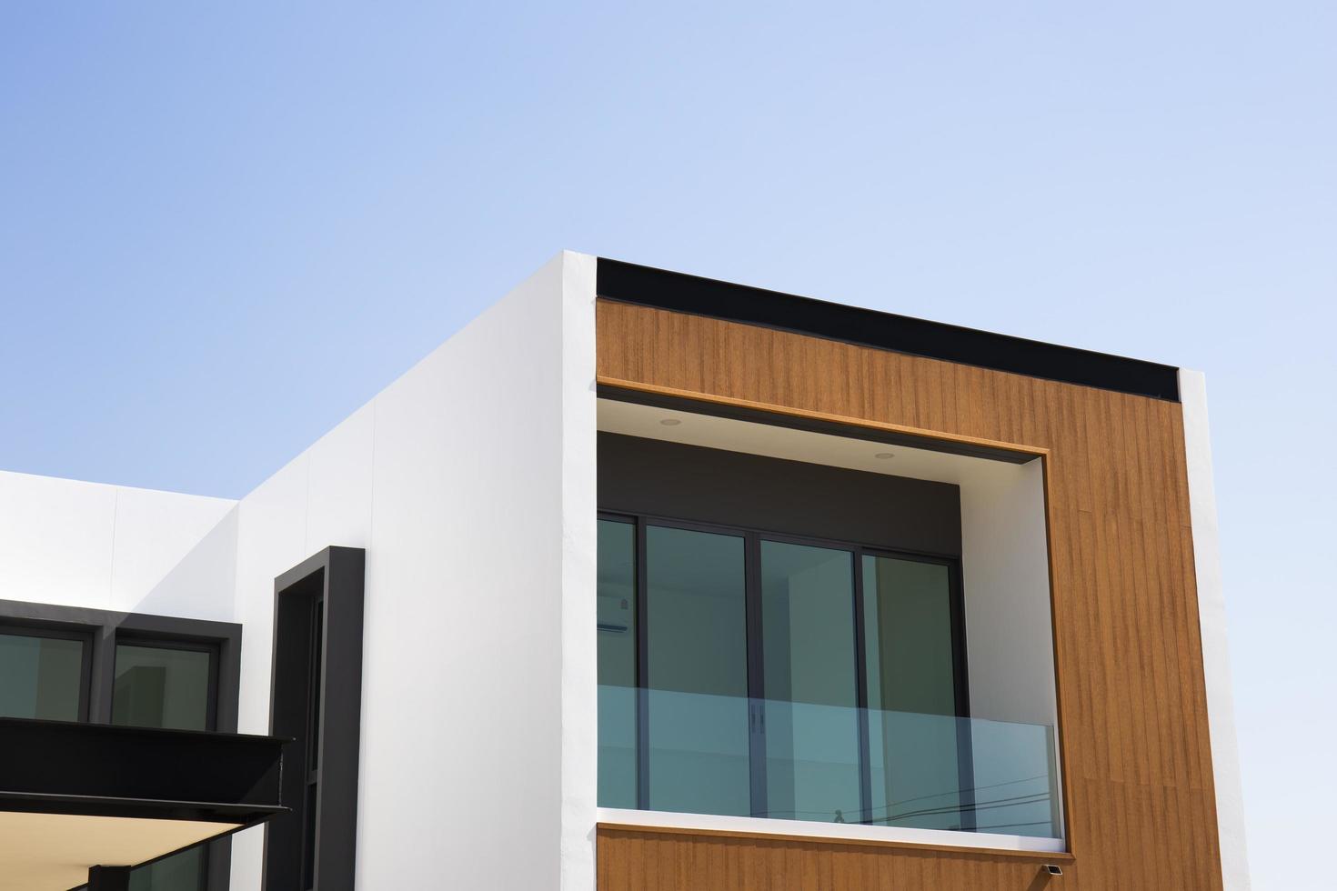 View of a modern style house outside of some buildings. photo