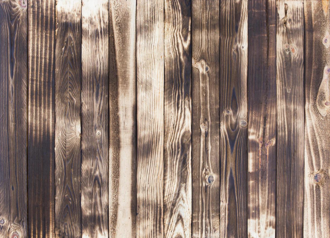 Old wood floors with traces of burnt black on abstract backgrounds and textures. photo