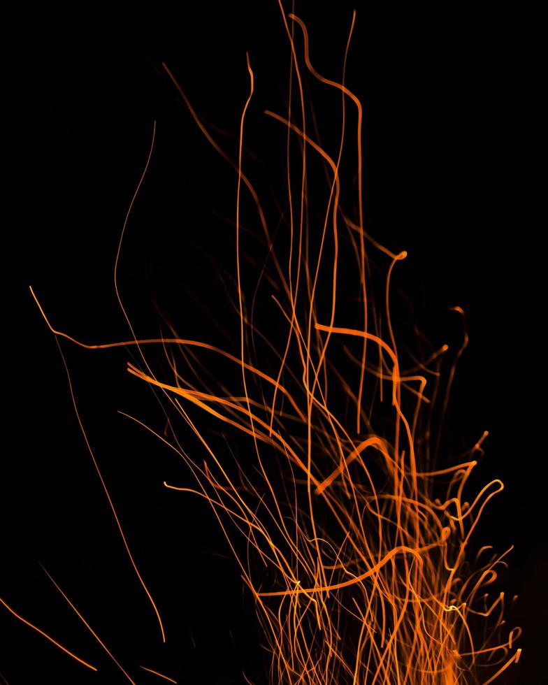 fire flames with sparks on a black background photo