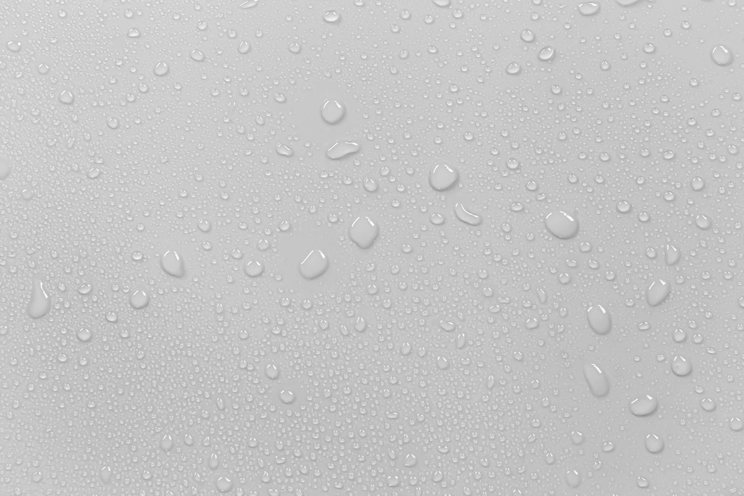 el concepto de gotas de lluvia que caen sobre un fondo gris superficie blanca húmeda abstracta con burbujas en la superficie gotas de agua de gotas de agua pura realistas para el diseño creativo de pancartas foto