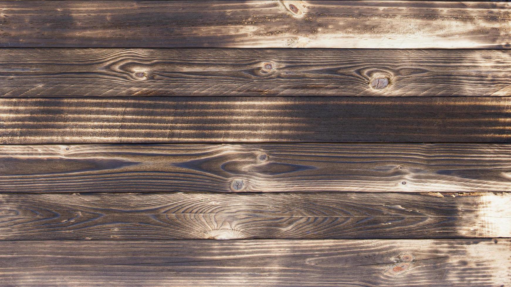 Old wood floors with traces of burnt black on abstract backgrounds and textures. photo