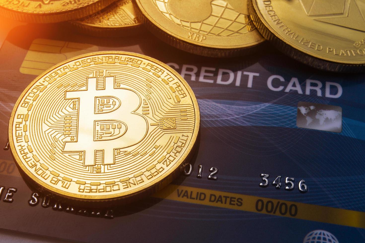 Close Up Gold bitcoin on credit card Concept background. photo