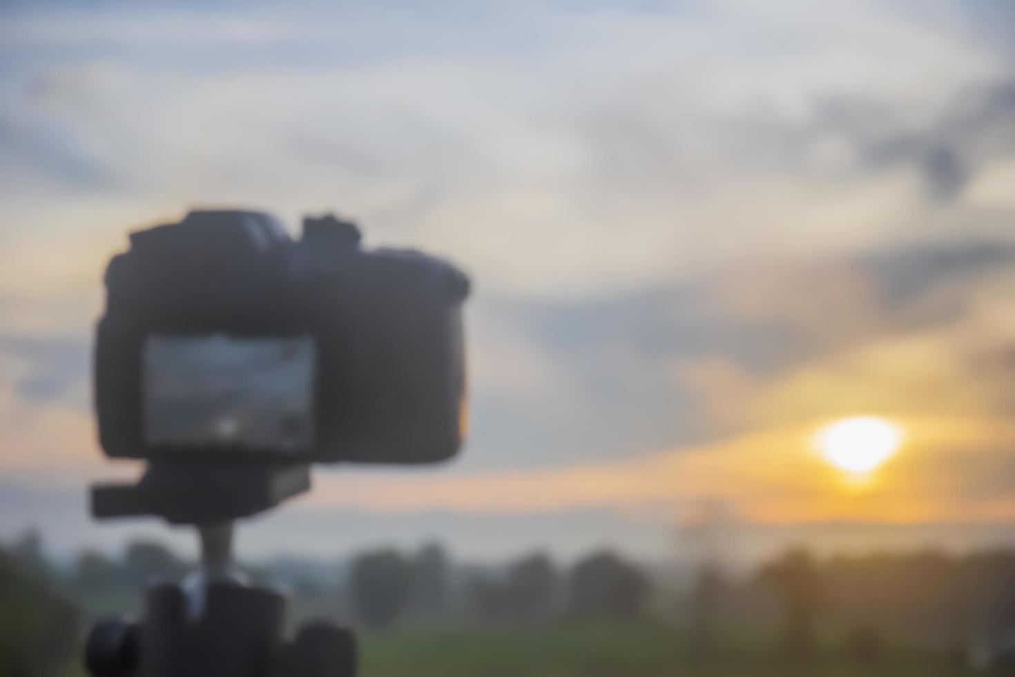 Blurred Digital camera taking pictures of nature in the morning. photo