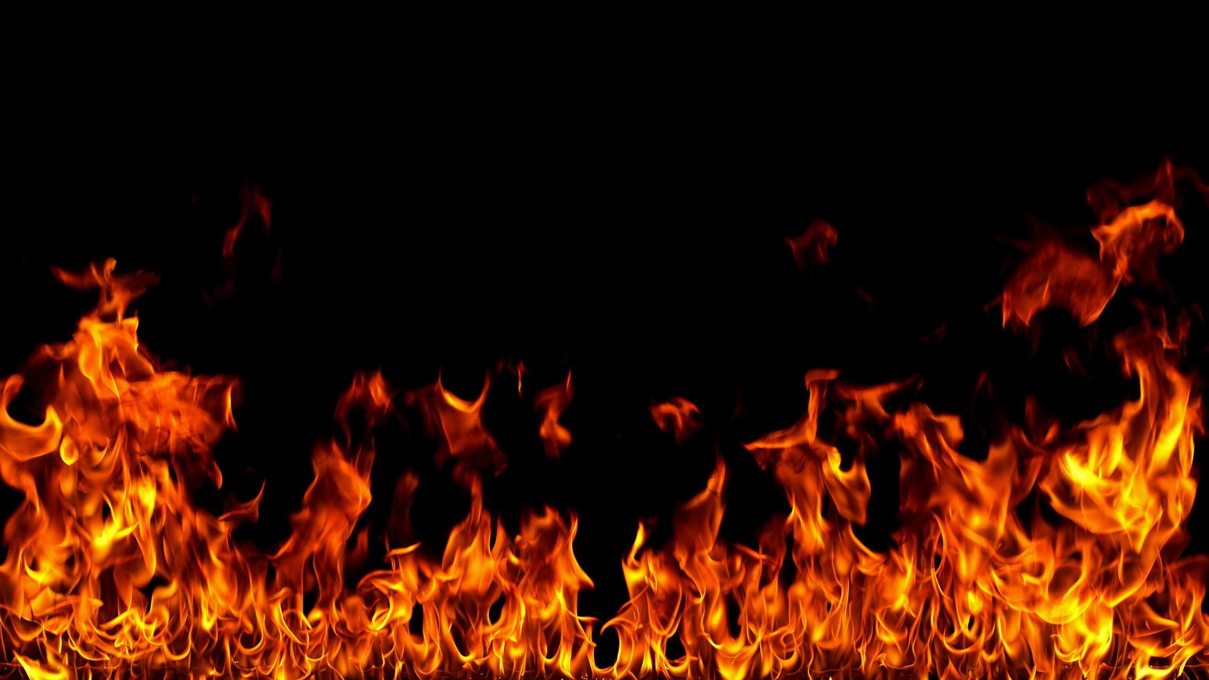 Fire flames on black background. photo