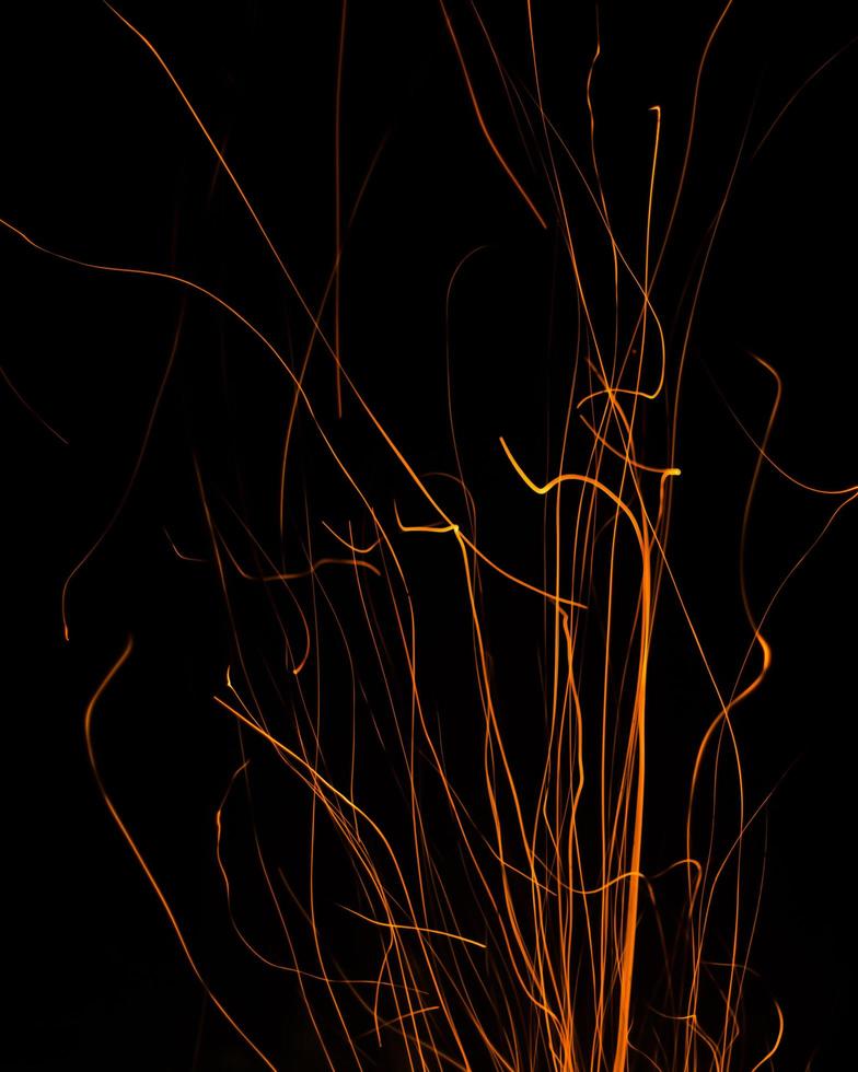 fire flames with sparks on a black background photo