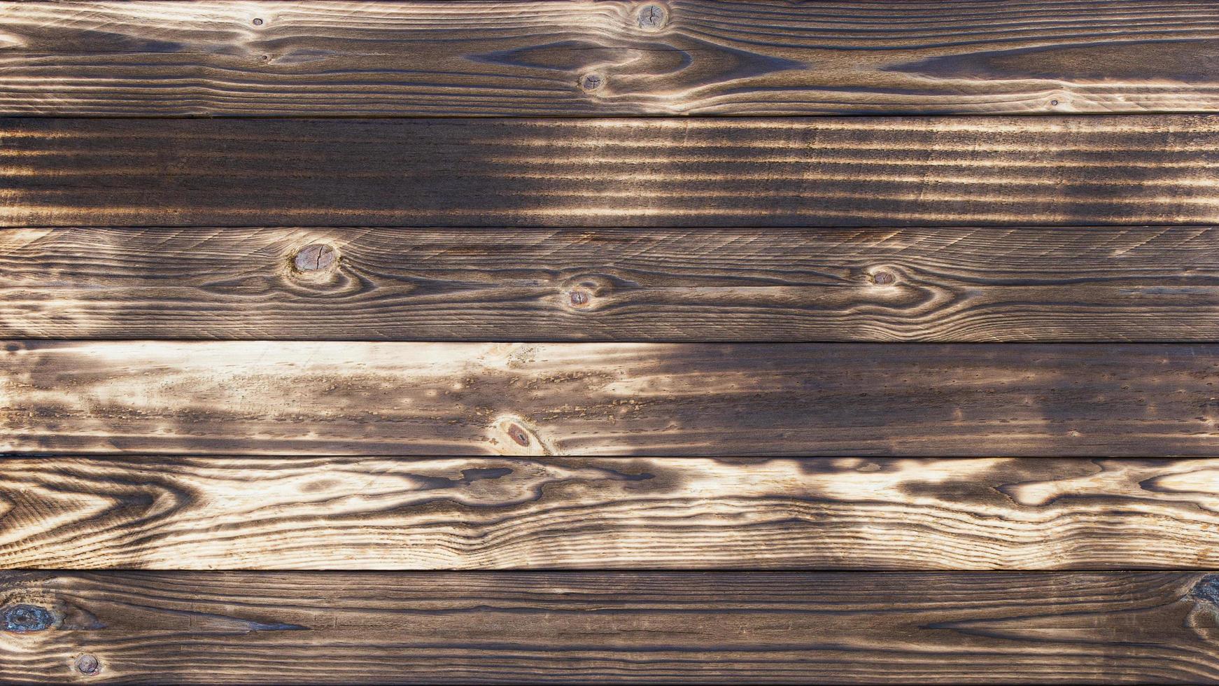 Old wood floors with traces of burnt black on abstract backgrounds and textures. photo