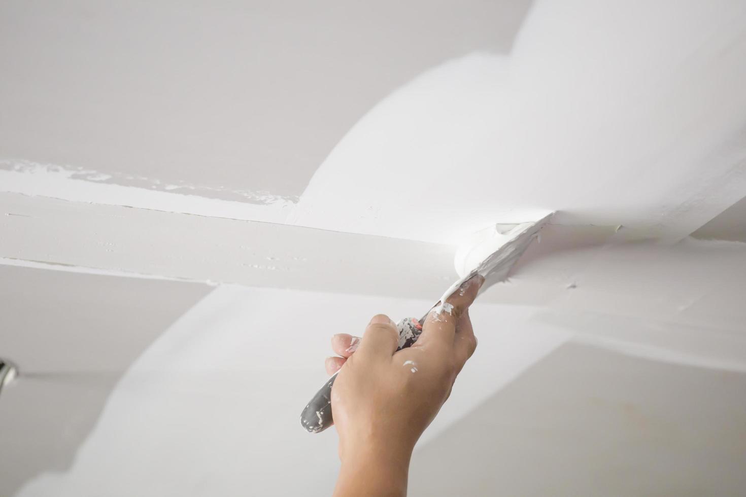 Hands of the ceiling technician photo