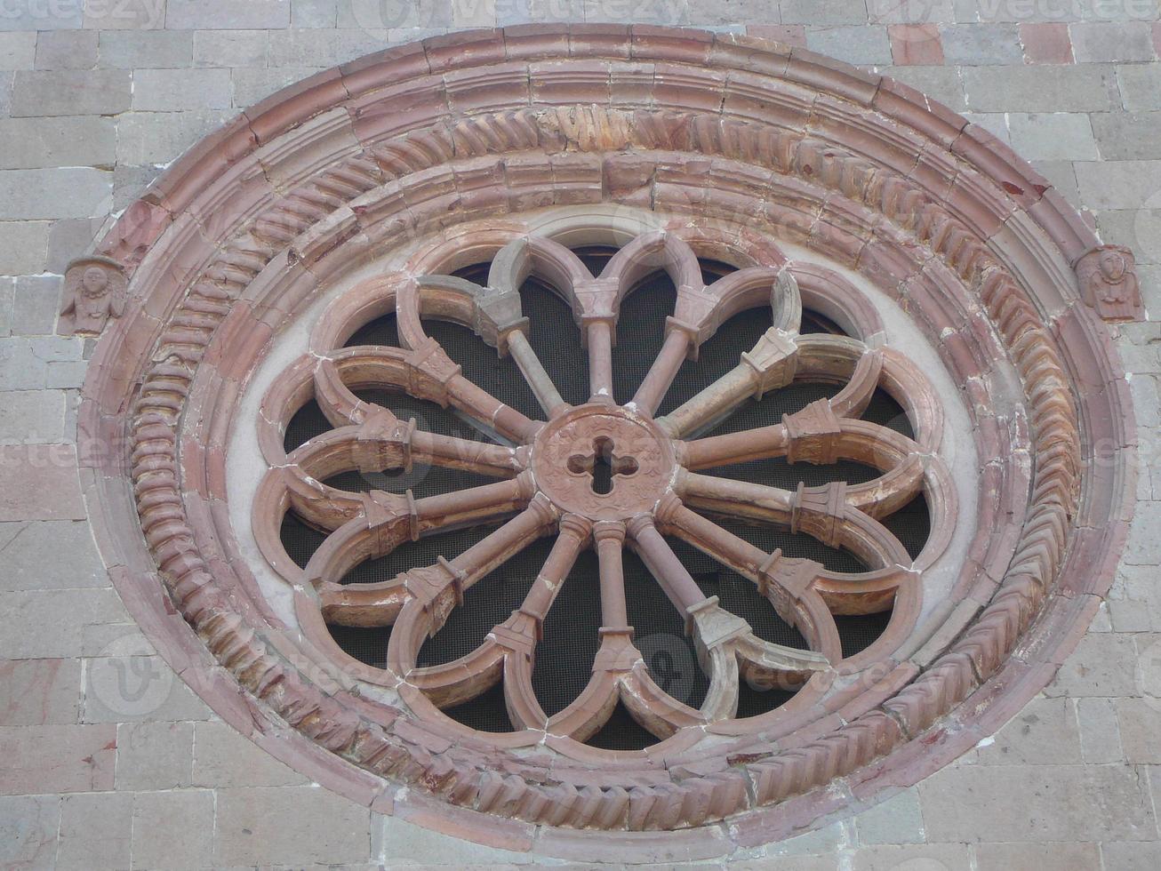 Detail of an ancient circular rose window photo