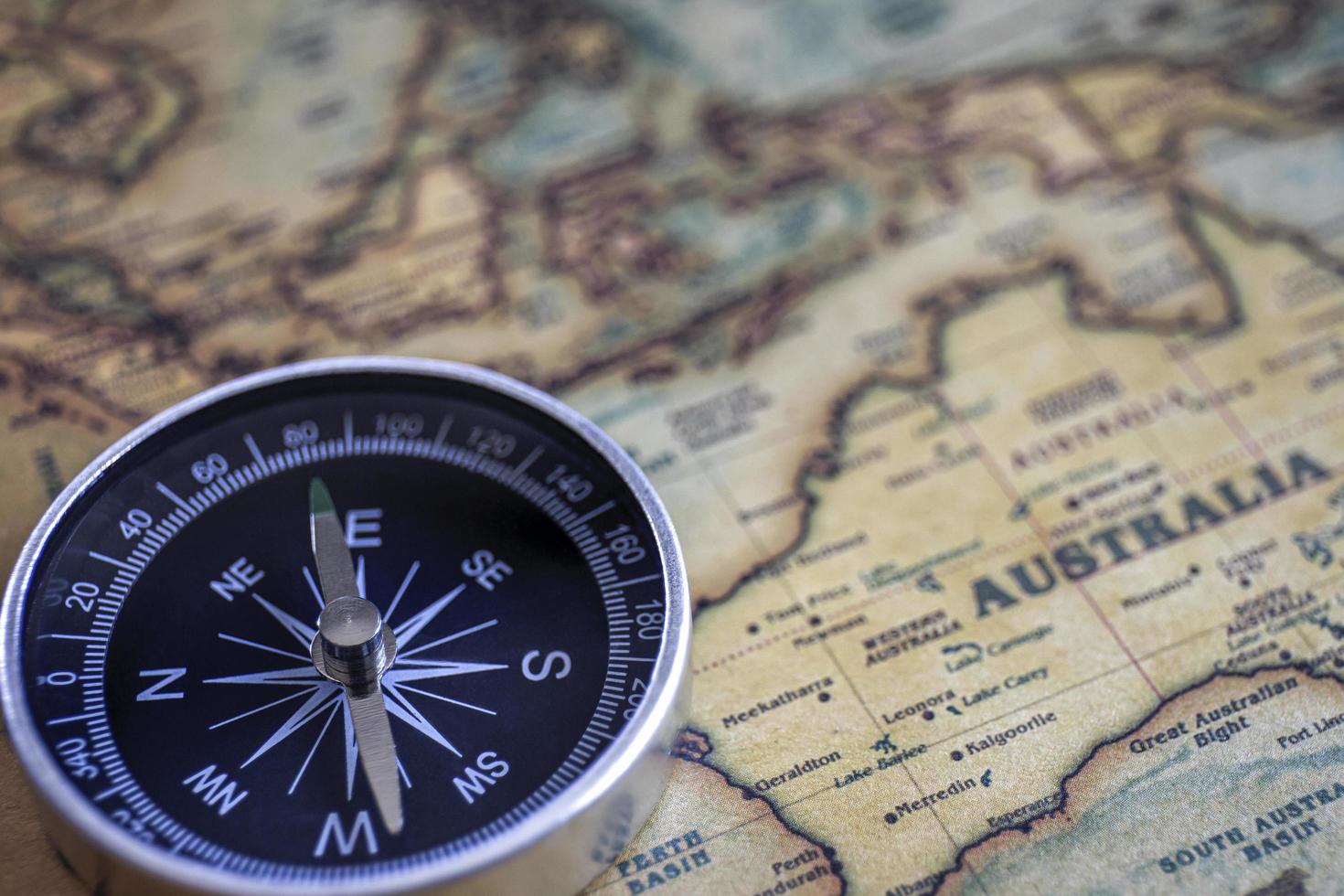 Compass on the background, old world map, vintage style, geo-navigation concept. photo