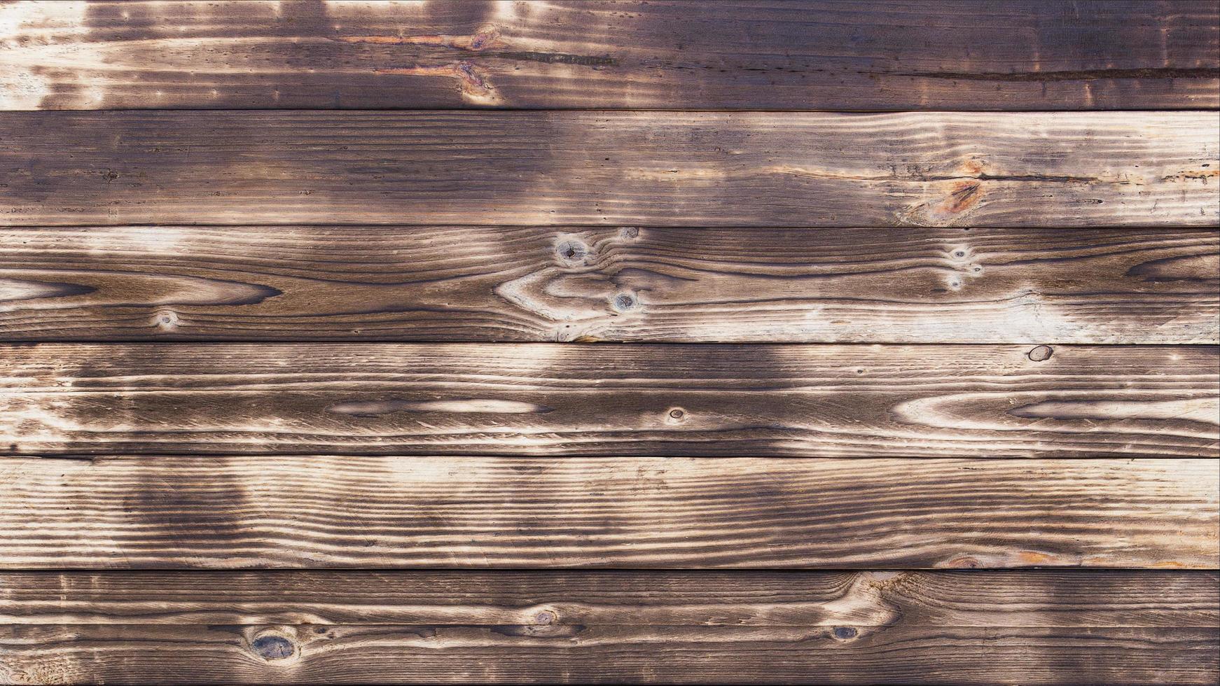 Old wood floors with traces of burnt black on abstract backgrounds and textures. photo